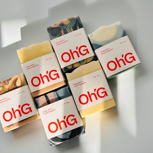 Soap collection from Oh Goodness - 6 soaps in part sun with bright red labels