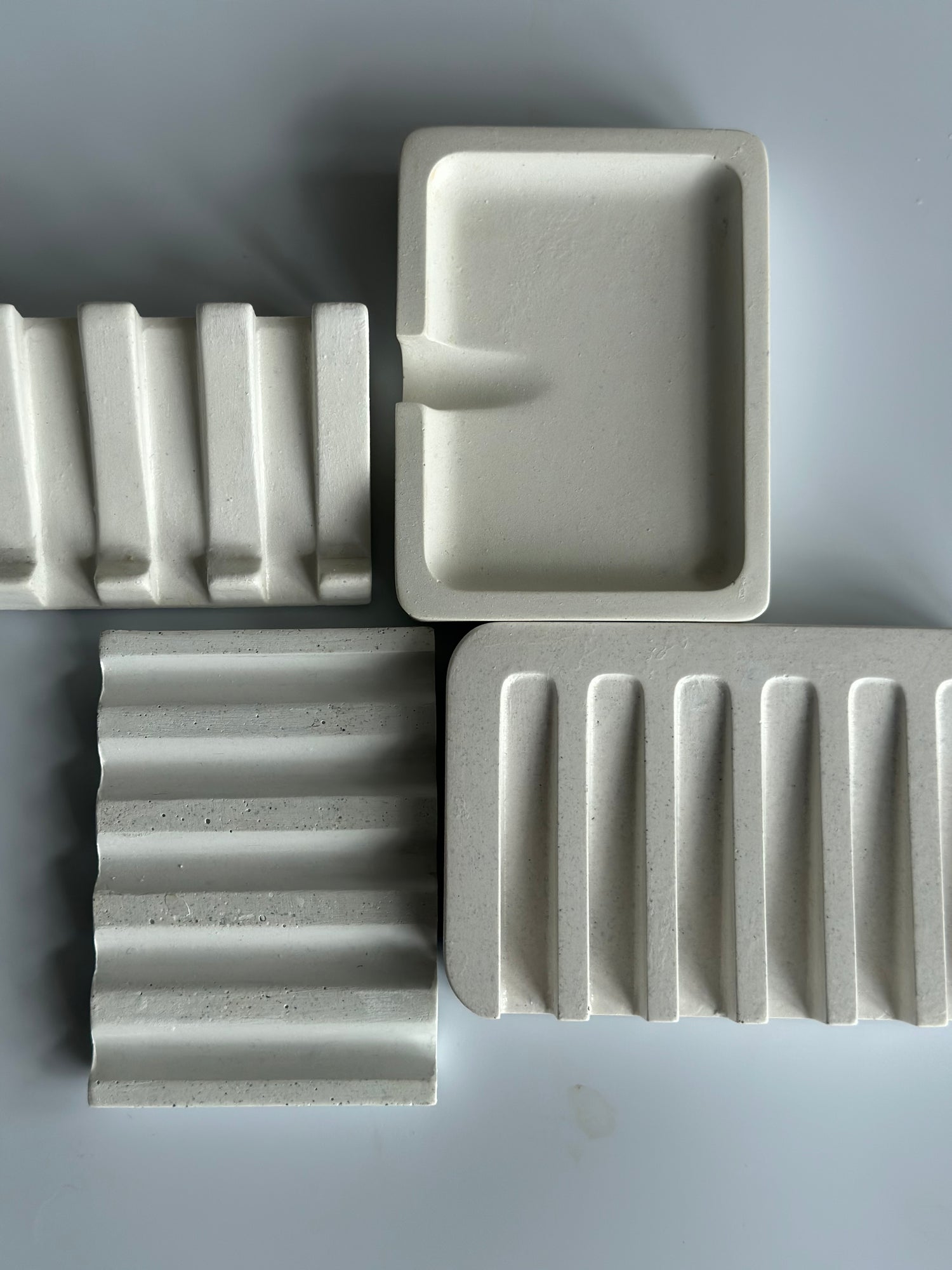collection of white soap dishes