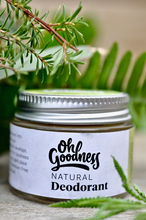 Natural deodorant in Lemongrass & Lime in a glass jar with decorative ferns.
